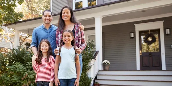 family standing in front of pest free home